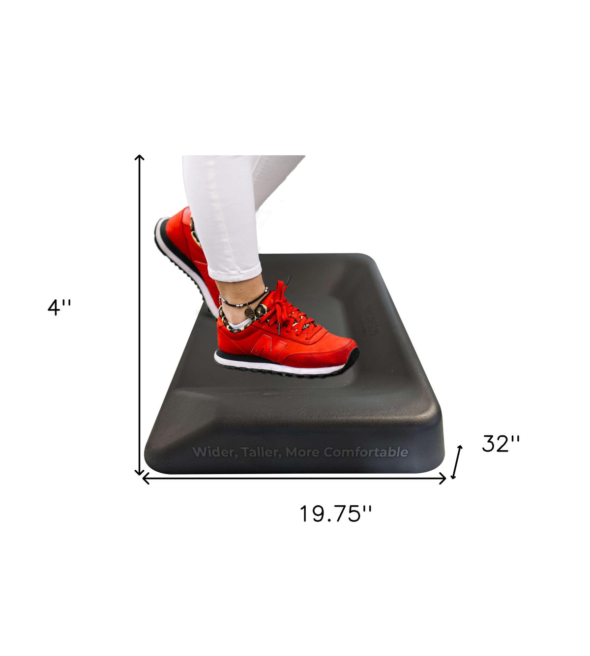 Woman in red sneakers standing on black anti-fatigue mat with dimensions shown: 19.75 x 32 x 4 inches