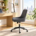 Dark gray linen office chair in a bright home office
