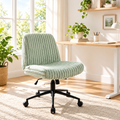 Sage green faux fur gaming chair with black base in a sunny home office