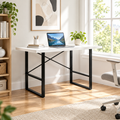 White and black computer desk in a bright home office