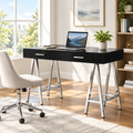 Black and silver writing desk with 2 drawers in a bright home office