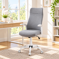 Gray high-back office chair with white armrests in a sunny home office