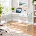 White and clear glass computer desk in a bright home office