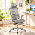 Gray ergonomic mesh gaming chair with footrest in a sunny home office
