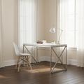 White and silver X-frame computer desk in a bright home office