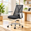 Black, white, and silver tri-tone office chair in a sunny home office