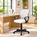 White mesh back task chair with black armrests and base in a sunny home office
