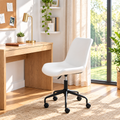 White faux leather office chair with black base in a sunny home office