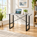 Gray and black computer desk in a bright home office