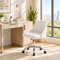 White faux leather armless office chair with chrome base in a sunny home office