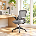Gray mesh and faux leather office chair in a sunny home office