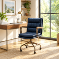 Navy leather vintage-style executive office chair in a sunny home office