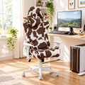 Brown and white cow print gaming chair in a sunny home office