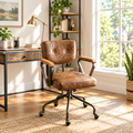 Vintage industrial tufted faux leather office chair in a sunny home office