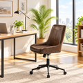 Dark brown faux leather armless office chair in a sunny home office