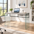 Gray and clear glass computer desk in a bright home office