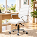White faux leather high-back office chair with chrome base in a sunny home office