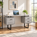 Gray and black computer desk with 3 drawers in a bright home office