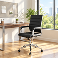 Black faux leather conference chair with silver frame in a sunny office