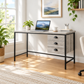 Gray and black computer desk with 3 drawers in a bright home office